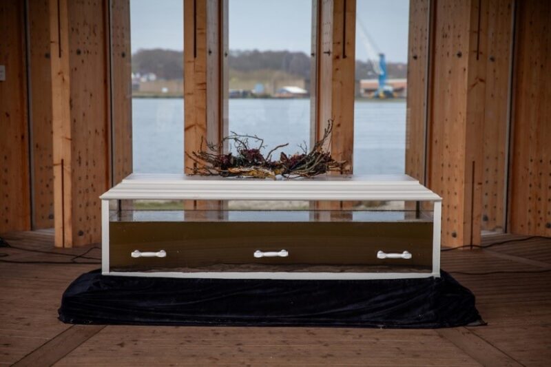 The body that represents the angling community across Europe has held a funeral to mourn the loss of life in a fjord that was once rich in fish species, animals and plants